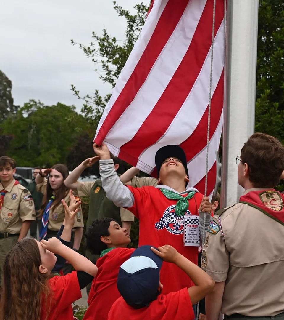 Scouts raising the flag